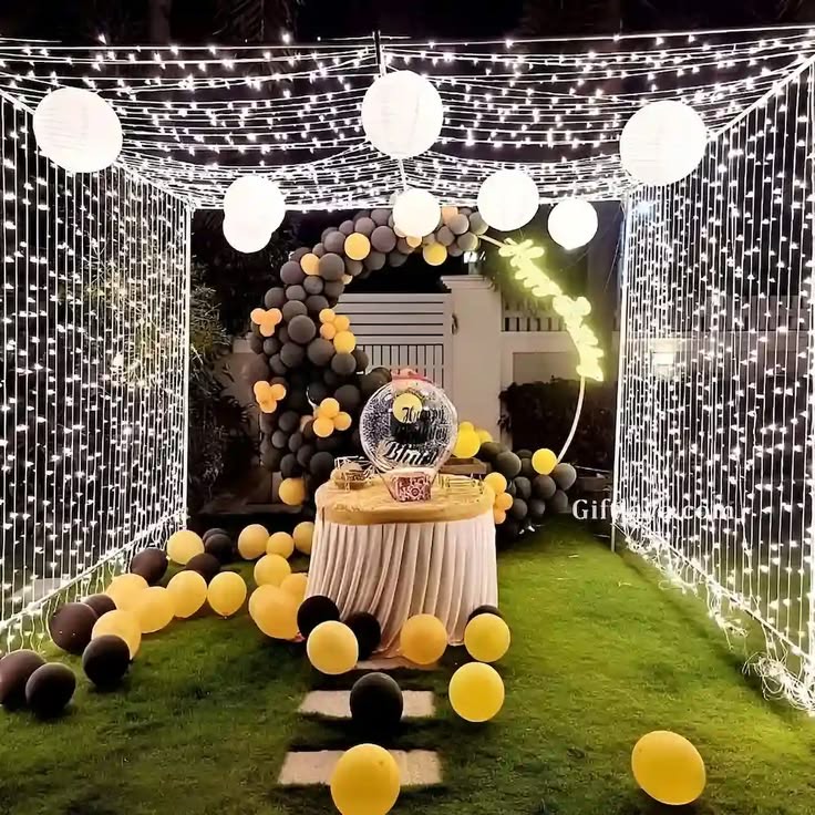 Romantic anniversary setup in Hyderabad with a decorated backdrop and floral table