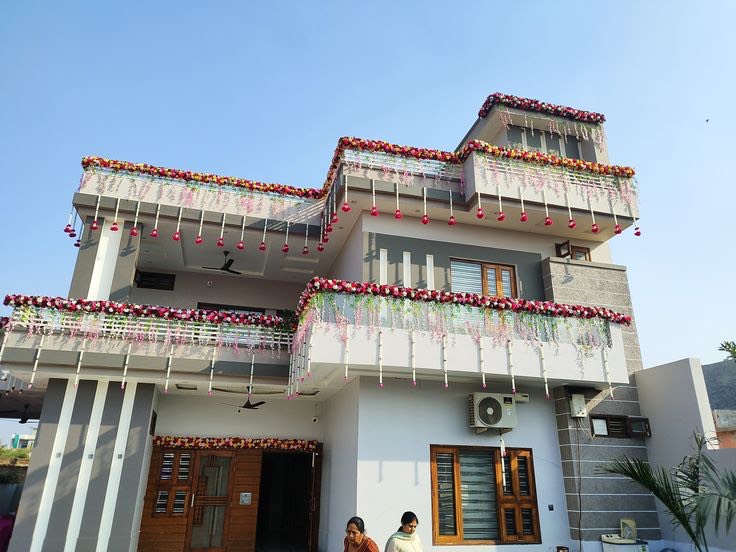Gruhapravesham entrance decoration in Hyderabad with mango leaf and marigold torans