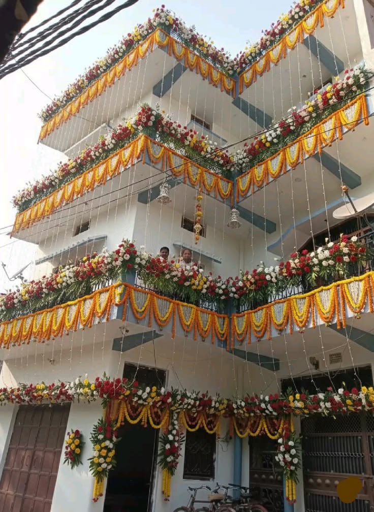House warming door decoration in Hyderabad with a floral arch over the entrance