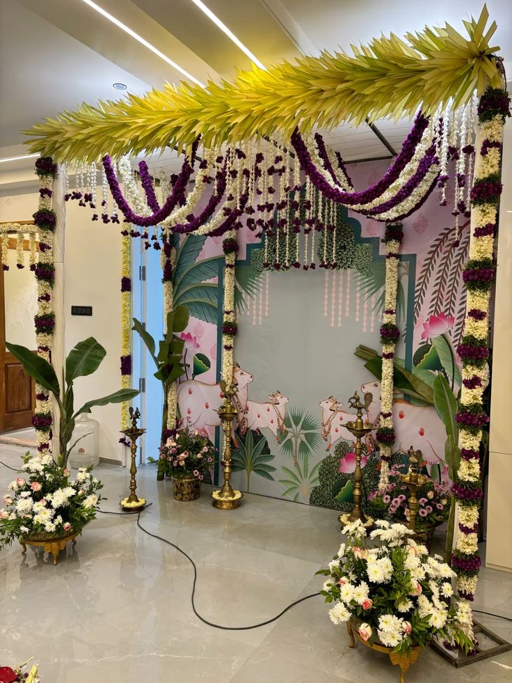 Gruhapravesham decoration in Hyderabad with banana stems and marigold framing the doorway