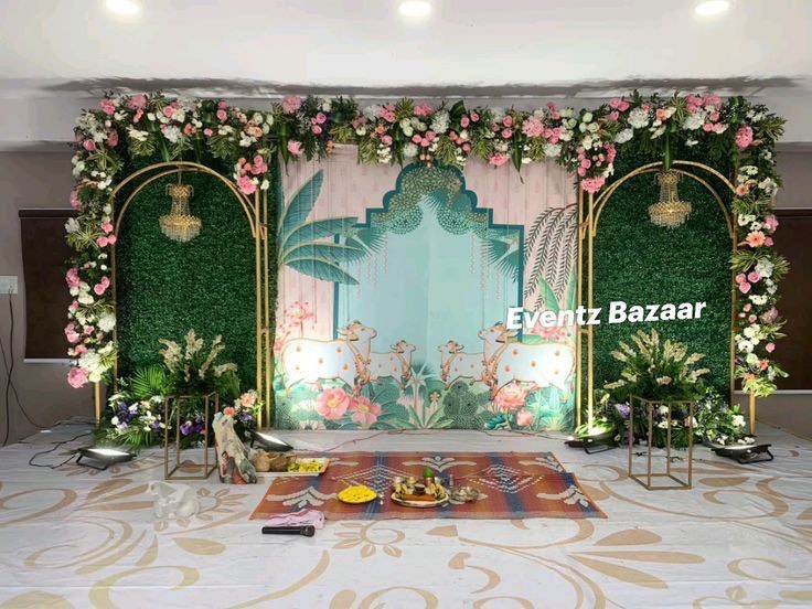 House warming entrance in Hyderabad decorated with fresh flower torans and a threshold rangoli