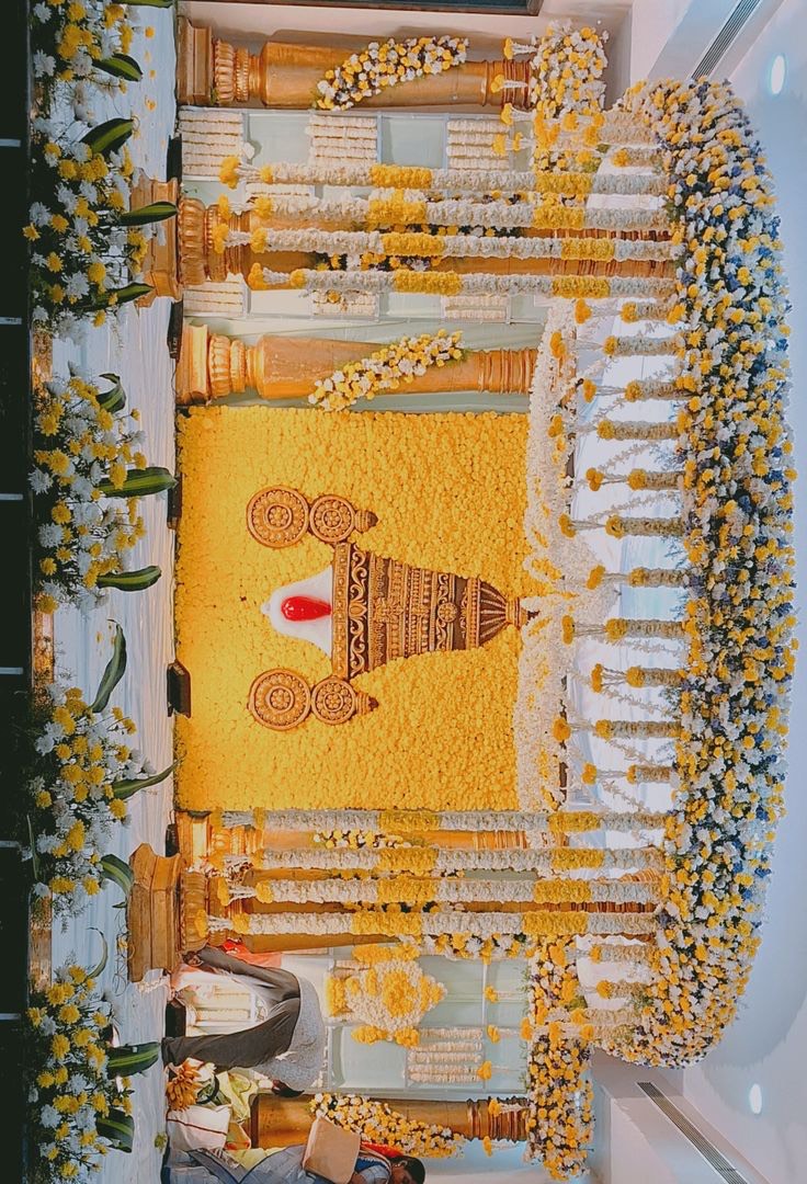 Marriage mandap setup in Hyderabad with draped fabric, floral pillars and a decorated deity platform