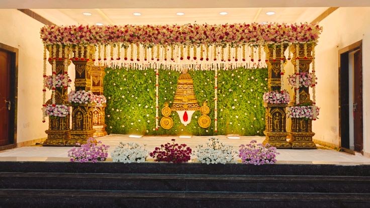 Wedding stage and mandap decoration in Hyderabad with a wide floral backdrop