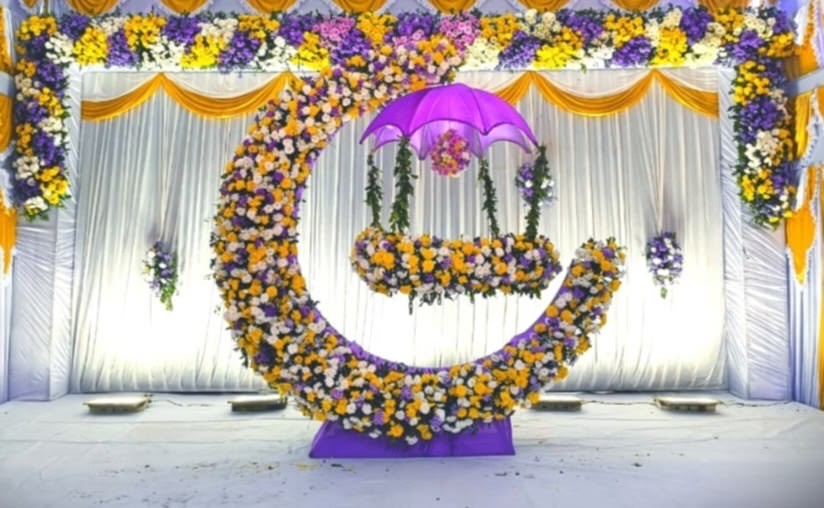 Cradle ceremony decoration in Hyderabad with pastel florals and a decorated naming table