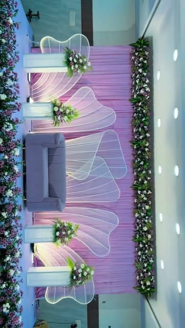 Reception couple seating decoration in Hyderabad framed with fresh flowers